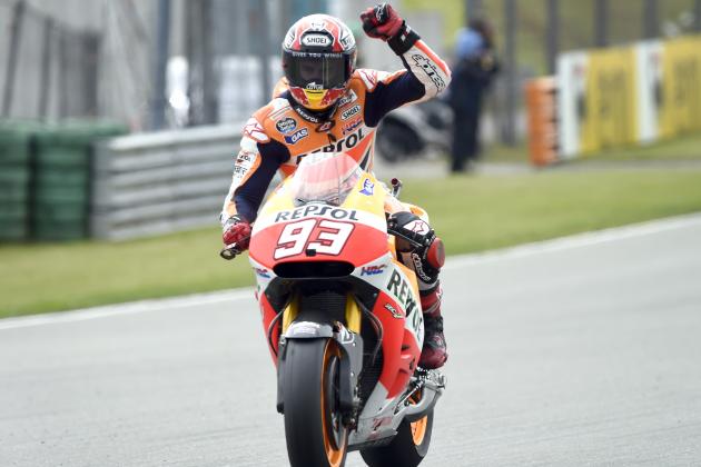 Marc Marquez from Spain celebrates winning the MotoGP race at the Sachsenring circuit in Hohenstein-Ernstthal, Germany, Sunday, July 13, 2014. (AP Photo/Jens Meyer)