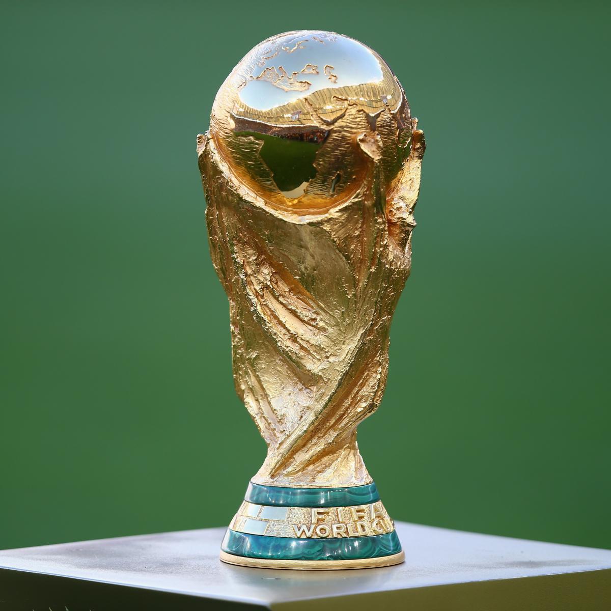 Who will be giving out the World Cup trophy?