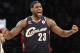 FILE - In this Dec. 25, 2009 file photo, Cleveland Cavaliers forward LeBron James reacts during the second half against the Los Angeles Lakers in an NBA basketball game in Los Angeles. James told Sports Illustrated on Friday, July 11, 2014, he is leaving the Miami Heat to go back to the Cleveland Cavaliers. (AP Photo/Lori Shepler, File)