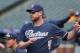 San Diego Padres third baseman Chase Headley warms up before facing the Colorado Rockies in the first inning of a baseball game in Denver on Saturday, May 17, 2014. (AP Photo/David Zalubowski)
