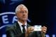 Former player Johan Cruyff of Netherlands, shows the name of Juventus, who will play Group B, during the UEFA Champions League draw in Monaco, Thursday, Aug. 29, 2013. (AP Photo/Claude Paris)