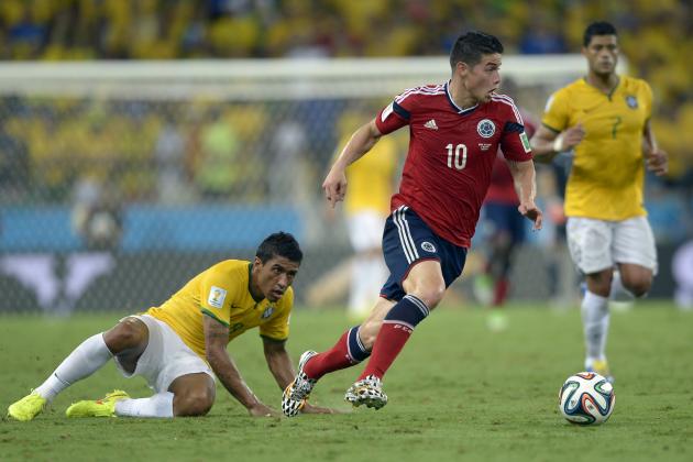 Colombia's James Rodriguez, right, gets away from Brazil's Paulinho during the World Cup quarterfinal soccer match between Brazil and Colombia at the Arena Castelao in Fortaleza, Brazil, Friday, July 4, 2014. (AP Photo/Manu Fernandez)