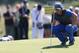 Rory McIlroy of Northern Ireland lines up a putt on the 5th green during the first day of the British Open Golf championship at the Royal Liverpool golf club, Hoylake, England, Thursday July 17, 2014. (AP Photo/Scott Heppell)