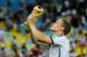 RIO DE JANEIRO, BRAZIL - JULY 13: Matthias Ginter celebrates with the trophy after defeating Argentina 1-0 in extra time during the 2014 FIFA World Cup Brazil Final match between Germany and Argentina at Maracana on July 13, 2014 in Rio de Janeiro, Brazil. (Photo by Matthias Hangst/Getty Images)
