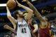 Minnesota Timberwolves' Kevin Love , left, looks to shoot as Cleveland Cavaliers' Tristan Thompson, right, defends in the first quarter of an NBA basketball game, Wednesday, Nov. 13, 2013, in Minneapolis. (AP Photo/Jim Mone)