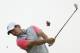 Rory McIlroy of Northern Ireland plays a shot off the 14th tee during the final round of the British Open Golf championship at the Royal Liverpool golf club, Hoylake, England, Sunday July 20, 2014. (AP Photo/Peter Morrison)