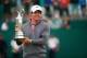 HOYLAKE, ENGLAND - JULY 20: Rory McIlroy of Northern Ireland holds the Claret Jug after his two-stroke victory at The 143rd Open Championship at Royal Liverpool on July 20, 2014 in Hoylake, England. (Photo by Tom Pennington/Getty Images)