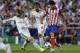 Real's Luka Modric,left and Real's Sami Khedira, centre, fight for the ball with Atletico's Diego Costa, during the Champions League final soccer match between Atletico Madrid and Real Madrid in Lisbon, Portugal, Saturday, May 24, 2014. (AP Photo/Francisco Seco)