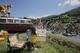 A child makes a painting of cyclists as the pack with Australia's Simon Gerrans passes during the sixteenth stage of the Tour de France cycling race over 237.5 kilometers (147.6 miles) with start in Carcassonne and finish in Bagneres-de-Luchon, France, Tuesday, July 22, 2014. (AP Photo/Christophe Ena)