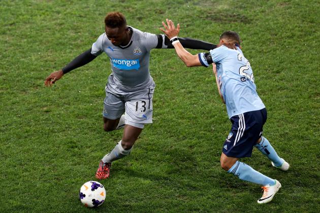 DUNEDIN, NEW ZEALAND - JULY 22:  Mapou Yanga-Mbiwa of Newcastle United holds off the defence of Ali Abbas of Sydney FC during the international friendly match between Newcastle United and Sydney FC at Forsyth Barr Stadium on July 22, 2014 in Dunedin, New Zealand.  (Photo by Hagen Hopkins/Getty Images)