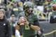 Oregon quarterback Marcus Mariota is shown warming up for an NCAA college football game against UCLA in Eugene, Ore., Saturday, Oct. 26, 2013. (AP Photo/Don Ryan)
