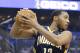 Indiana Pacers' Evan Turner (12) grabs a rebound against the Orlando Magic during the first half of an NBA basketball game in Orlando, Fla., Wednesday, April 16, 2014. (AP Photo/John Raoux)