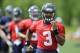 Seattle Seahawks quarterback Russell Wilson runs during an NFL football organized team activity, Monday, June 9, 2014 in Renton, Wash. (AP Photo/Ted S. Warren)