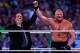Paul Heyman, left, celebrates with Brock Lesnar after his win over the Undertaker during Wrestlemania XXX at the Mercedes-Benz Super Dome in New Orleans on Sunday, April 6, 2014. (Jonathan Bachman/AP Images for WWE)