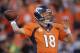 Denver Broncos quarterback Peyton Manning (18) passes the ball during the second half of the AFC Championship NFL playoff football game against the New England Patriots in Denver, Sunday, Jan. 19, 2014. (AP Photo/Joe Mahoney)