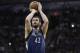 Minnesota Timberwolves' Kevin Love shoots a free throw against the San Antonio Spurs during the second half on an NBA basketball game, Friday, Dec. 13, 2013, in San Antonio. San Antonio won 117-110. (AP Photo/Eric Gay)