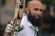 South African batsman Hashim Amla rasies his bat to celebrate scoring a century during the third day of the second test cricket match between South Africa and Sri Lanka in Colombo, Sri Lanka, Saturday, July 26, 2014. (AP Photo/Sanka Gayashan)
