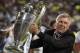 Real's coach Carlo Ancelotti lifts the Champion League trophy after his team won, at the end of the Champions League final soccer match between Atletico Madrid and Real Madrid in Lisbon, Portugal, Saturday, May 24, 2014.(AP Photo/Manu Fernandez)