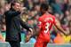 NORWICH, ENGLAND - APRIL 20: Raheem Sterling of Liverpool celebrates scoring the opening goal with Manager Brendan Rodgers of Liverpool during the Barclays Premier League match between Norwich City and Liverpool at Carrow Road on April 20, 2014 in Norwich, England. (Photo by Michael Regan/Getty Images)