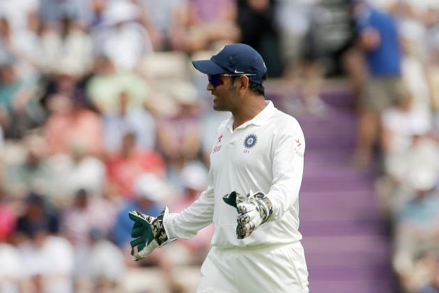 India's captain and wicketkeeper Mahendra Singh Dhoni gives a teammate fielding instructions during the first day of the third cricket test match of the series between England and India at The Ageas Bowl in Southampton, England, Sunday, July 27, 2014.  (AP Photo/Matt Dunham)