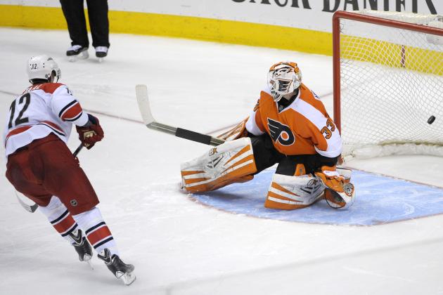 Apr 13, 2014; Philadelphia, PA, USA; Carolina Hurricanes center Eric Staal (12) scores a goal on Philadelphia Flyers goalie Cal Heeter (33) during the shootout at Wells Fargo Center. The Hurricanes won 6-5 in a shootout. Mandatory Credit: Eric Hartline-USA TODAY Sports