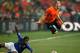 PORT ELIZABETH, SOUTH AFRICA - JULY 02: Arjen Robben of The Netherlands dives over the tackle of Michel Bastos of Brazil during the 2010 FIFA World Cup South Africa Quarter Final match between Netherlands and Brazil at Nelson Mandela Bay Stadium on July 2, 2010 in Nelson Mandela Bay/Port Elizabeth, South Africa. (Photo by Richard Heathcote/Getty Images)