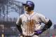 Colorado Rockies shortstop Troy Tulowitzki (2) grimaces as he walks back to the dugout after grounding out to end the fourth inning of a baseball game against the Pittsburgh Pirates in Pittsburgh Saturday, July 19, 2014. Tulowitzki left the game.(AP Photo/Gene J. Puskar)