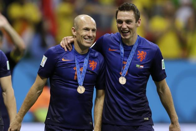 Netherlands' Arjen Robben, left and Stefan de Vrij walk together after medal presentations following their  3-0 victory over Brazil in the World Cup third-place soccer match between Brazil and the Netherlands at the Estadio Nacional in Brasilia, Brazil, Saturday, July 12, 2014. (AP Photo/Natacha Pisarenko)