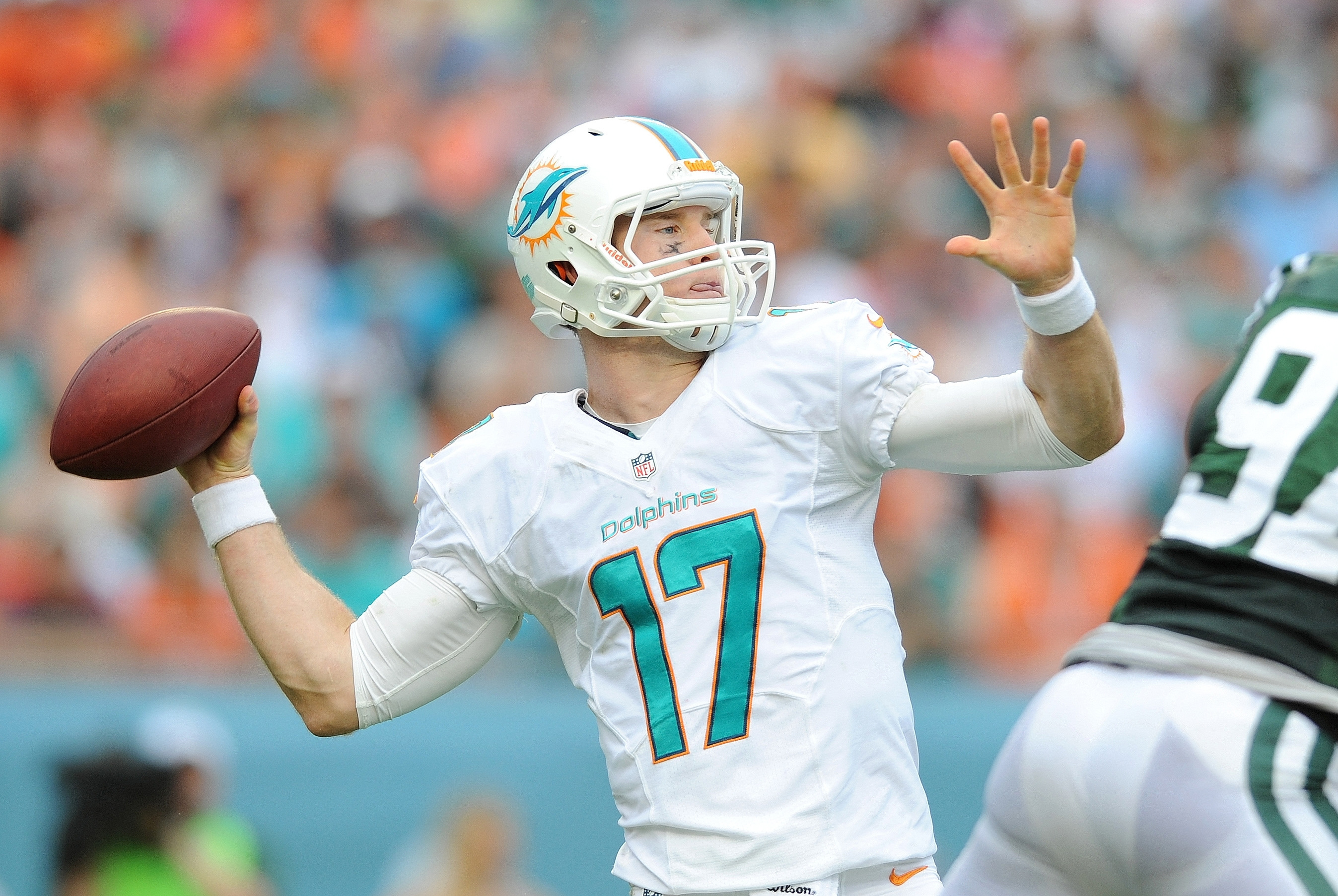 Miami Dolphins quarterback Ryan Tannehill (17) watches from the sidelines  while rocking the be…