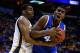 ST LOUIS, MO - MARCH 23: Dakari Johnson #44 of the Kentucky Wildcats drives to the basket against Darius Carter #12 of the Wichita State Shockers during the third round of the 2014 NCAA Men's Basketball Tournament at Scottrade Center on March 23, 2014 in St Louis, Missouri. (Photo by Andy Lyons/Getty Images)