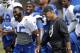 Indianapolis Colts head coach Chuck Pagano, right, laughs with running back Chris Rainey during an NFL football training camp in Anderson, Ind., Saturday, July 26, 2014. (AP Photo/Michael Conroy)