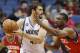 Minnesota Timberwolves forward Kevin Love, left, looks to drive against Philadelphia 76ers forward Thaddeus Young, right, during the first quarter of an NBA basketball game in Minneapolis, Wednesday, Dec. 11, 2013. (AP Photo/Ann Heisenfelt)