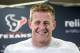 Houston Texans' J.J. Watt smiles as he answers a question after reporting for NFL football training camp Friday, July 25, 2014, in Houston. The Texans begin practices Saturday. (AP Photo/David J. Phillip)