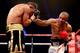LONDON, ENGLAND - DECEMBER 14: Leonard Bundu (R) in action with Lee Purdy during their European Welterweight Title bout at ExCel on December 14, 2013 in London, England. (Photo by Scott Heavey/Getty Images)