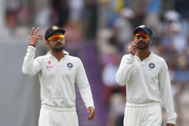SOUTHAMPTON, ENGLAND - JULY 27: Virat Kohli and Shikhar Dhawan of India talk as they walk out onto the pitch for the second session during Day 1 of the 3rd Investec Test match between England and India at the Ageas Bowl on July 27, 2014 in Southampton, England. (Photo by Christopher Lee/Getty Images)