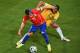 CUIABA, BRAZIL - JUNE 13: Gary Medel of Chile fights off a challenge by Tim Cahill of Australia during the 2014 FIFA World Cup Brazil Group B match between Chile and Australia at Arena Pantanal on June 13, 2014 in Cuiaba, Brazil. (Photo by Stu Forster/Getty Images)