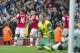 Arsenal's Aaron Ramsey, left, celebrates with teammate Jack Wilshere, second left, after scoring against Norwich City, during their English Premier League soccer match, at the Emirates Stadium, in London, Saturday, Oct. 19, 2013. (AP Photo/Bogdan Maran)