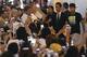 Brazilian soccer player Neymar, right, approaches to his fans upon arrival at Haneda airport in Tokyo, Thursday, July 31, 2014. Neymar is in Tokyo for several promotional events. (AP Photo/Eugene Hoshiko)