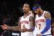 New York Knicks' J.R. Smith (8) talks with teammate Carmelo Anthony (7) as they walk off the court during a timeout late in the fourth quarter of an NBA basketball game against the Miami Heat, Saturday, Feb. 1, 2014, in New York. Miami won 106-91. (AP Photo/Jason DeCrow)