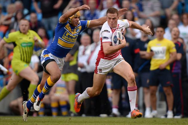MANCHESTER, ENGLAND - MAY 17: Joe Burgess of Wigan Warriors gets past Ben Jones-Bishop of Leeds Rhinos during the Super League match between Wigan Warriors and Leeds Rhinos at Etihad Stadium on May 17, 2014 in Manchester, England. (Photo by Gareth Copley/Getty Images)