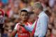 Arsenal's French manager Arsene Wenger, right, gives instructions to his new signing Alexis Sanchez as he substituted on to make his debut, during the Emirates Cup soccer match between between Arsenal and Benfica at Arsenal's Emirates Stadium in London, Saturday, Aug. 2, 2014. (AP Photo/Matt Dunham)