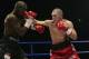 MANCHESTER - OCTOBER 18: Jamie Moore of Great Britain lands with a straight right on Gary Logan of Great Britain during the British and Commonwealth Light Middle-weight fight between Gary Logan of Great Britain and Jamie Moore of Great Britain on October 18, 2003 at the MEN Arena, Manchester. (Photo by John Gichigi/Getty Images)