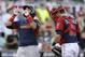 World's Javier Baez, left, reacts in front of U.S. catcher Justin O'Conner, right, after hitting a two-run home run in the sixth inning of the All-Star Futures baseball game, Sunday, July 13, 2014, in Minneapolis. (AP Photo/Jeff Roberson)