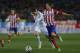 Atletico's Javi Manquillo, bottom, commits a foul on Real's Cristiano Ronaldo, front, during a semi final, 2nd leg, Copa del Rey soccer match between Atletico de Madrid and Real Madrid at the Vicente Calderon stadium in Madrid, Spain, Tuesday, Feb. 11, 2014. (AP Photo/Andres Kudacki)