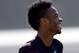 England national soccer team players Wayne Rooney, center, and Raheem Sterling, left, laugh together at the start of a squad training session for the 2014 soccer World Cup at the Urca military base in Rio de Janeiro, Brazil, Monday, June 16, 2014. (AP Photo/Matt Dunham)