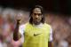 AS Monaco substitute Radamel Falcao gives a thumbs up to fans as he warms up on the sideline during the second half of the Emirates Cup soccer match between AS Monaco and Valencia at Arsenal's Emirates Stadium in London, Saturday, Aug. 2, 2014. (AP Photo/Matt Dunham)