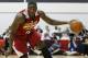 The Cleveland Cavaliers' Anthony Bennett drives toward the basket against the Milwaukee Bucks in an NBA summer league basketball game Friday, July 11, 2014, in Las Vegas. (AP Photo/John Locher)