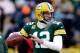 GREEN BAY, WI - JANUARY 05: Aaron Rodgers #12 of the Green Bay Packers looks to throw a pass during warm ups prior to their NFC Wild Card Playoff game against the San Francisco 49ers at Lambeau Field on January 5, 2014 in Green Bay, Wisconsin. (Photo by Mike McGinnis/Getty Images)