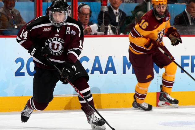 PHILADELPHIA, PA - APRIL 12:  Shayne Gostisbehere #14 of the Union College Dutchmen takes the puck as Nate Condon #25 of the Minnesota Golden Gophers defends during the 2014 NCAA Division I Men's Hockey Championship Game at Wells Fargo Center on April 12, 2014 in Philadelphia, Pennsylvania.  (Photo by Elsa/Getty Images)