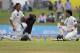Pakistani cricketers Younis Khan, left, and captain Misbah-ul-Haq rest during a break on the first day of the first test cricket match between Sri Lanka and Pakistan in Galle, Sri Lanka, Wednesday, Aug. 6, 2014. (AP Photo/Eranga Jayawardena)